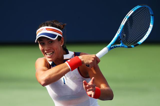Garbine Muguruza of Spain returns a shot to Magdalena Rybarikova of Slovakia at the US Open. (AFP)