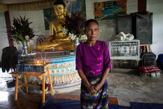 San Mae, 52, stands near a statue of Buddha at an internally displaced persons (IDP) camp in Sittwe. Rakhine, Myanmar's poorest state, has become a crucible of religious hatred focused on the Muslim Rohingya, who are reviled and perceived as illegal immigrants in Buddhist-majority Myanmar. (AFP Photo)