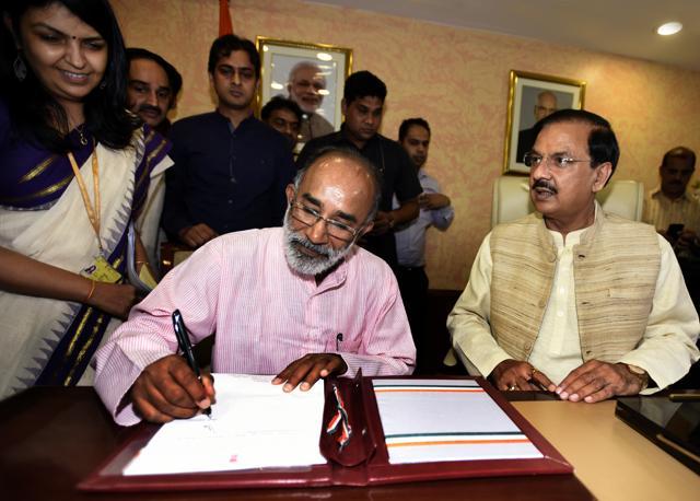 Outgoing Minister Mahesh Sharma welcomes Alphons Kannanthanam , Minister of State (Independent Charge) for Tourism, as he takes over the charge in his office at Transport Bhawan in New Delhi, on September 4, 2017. (Sonu Mehta/HT PHOTO) Outgoing Minister Mahesh Sharma welcomes Alphons Kannanthanam , Minister of State (Independent Charge) for Tourism, as he takes over the charge in his office at Transport Bhawan in New Delhi, on September 4, 2017. (Sonu Mehta/HT PHOTO)