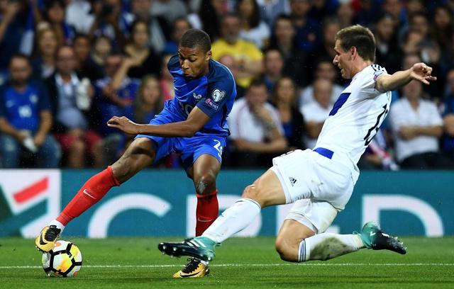France's forward Kylian Mbappe (L) fights for the ball with Luxembourg's defender Dirk Carlson. (AFP) France's forward Kylian Mbappe (L) fights for the ball with Luxembourg's defender Dirk Carlson. (AFP)