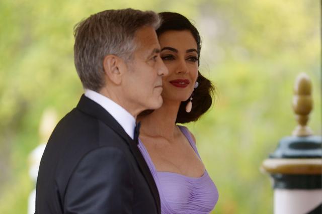 US actor George Clooney and his wife Amal arrive at the Excelsior Hotel during the 74th Venice Film Festival. (AFP)