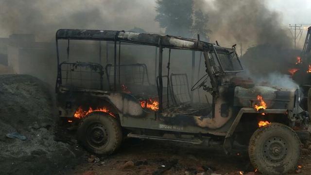 The irate mob also set on fire a police vehicle. (HT photo) The irate mob also set on fire a police vehicle. (HT photo)