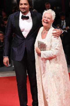 He was also accompanied by co-star Judi.