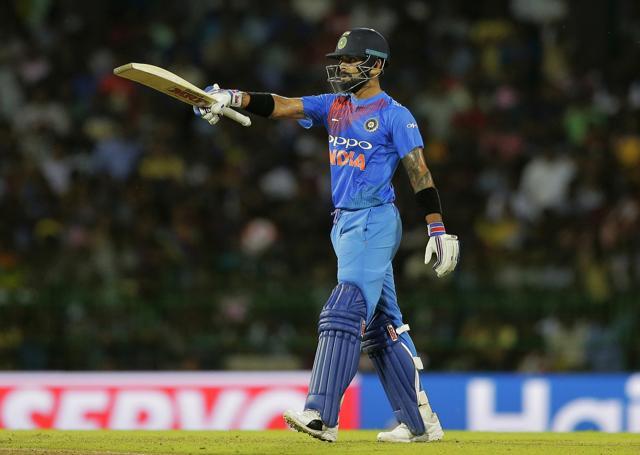 India captain Virat Kohli raises his bat after scoring a half century during the Twenty20 cricket match against Sri Lanka in Colombo. (AP) India captain Virat Kohli raises his bat after scoring a half century during the Twenty20 cricket match against Sri Lanka in Colombo. (AP)