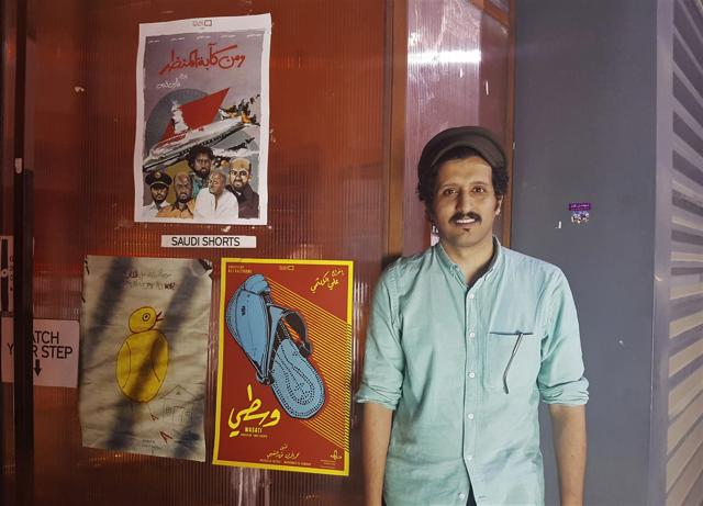 Saudi filmmaker Ali Kalthami on August 25, 2017 stands next to the poster for his film Wasati and two other short films recently shown at Cinema Akil in Dubai. (AP) Saudi filmmaker Ali Kalthami on August 25, 2017 stands next to the poster for his film Wasati and two other short films recently shown at Cinema Akil in Dubai. (AP)