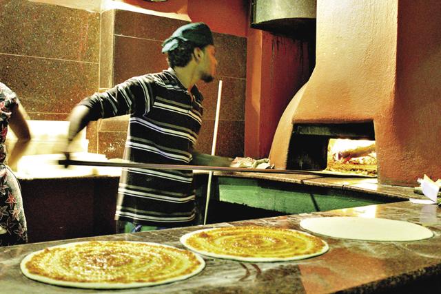 At Tanto’s pizzeria, they hand roll the base in front of you and ingredients are sourced from local farms (Divya Rai)