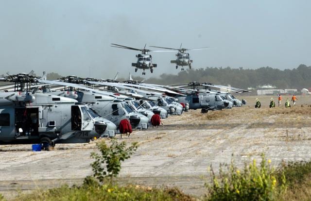 U.S. Navy helicopters land at Maxwell Air Force Base in Montgomery, Ala., on Friday, Sept. 8, 2017. The helicopters came from Florida and were flown in to be protected from Hurricane Irma. (AP) U.S. Navy helicopters land at Maxwell Air Force Base in Montgomery, Ala., on Friday, Sept. 8, 2017. The helicopters came from Florida and were flown in to be protected from Hurricane Irma. (AP)