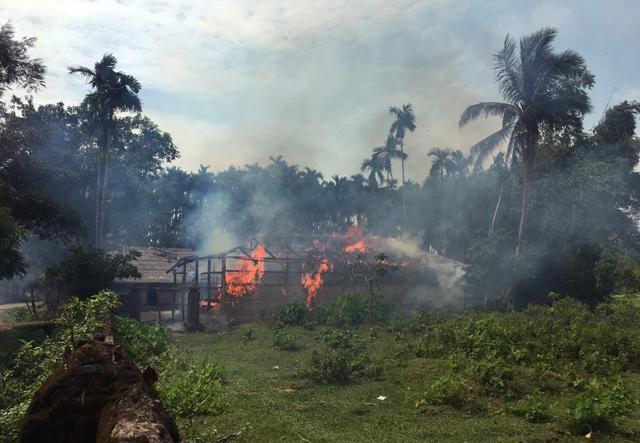 Fire engulfs homes in the Gawdu Zara village, northern Rakhine state, Myanmar on September 7. (AP Photo)