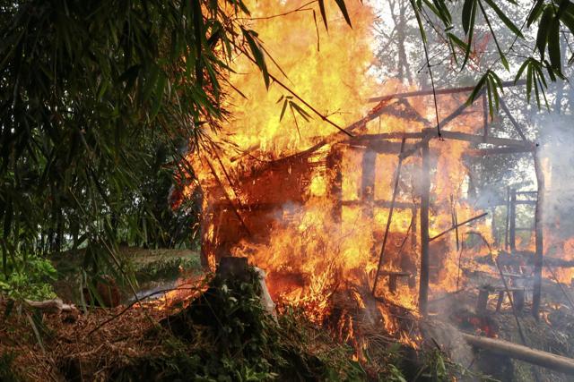 A house burns in Gawdu Tharya village near Maungdaw in Rakhine state in northern Myanmar. (AFP)