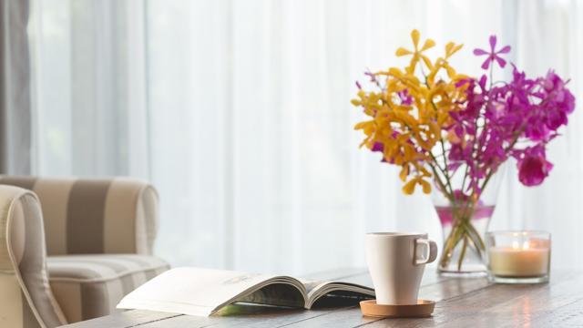 Fresh flowers and scented candles are a simple and inexpensive way of brightening a living space. (Shutterstock)