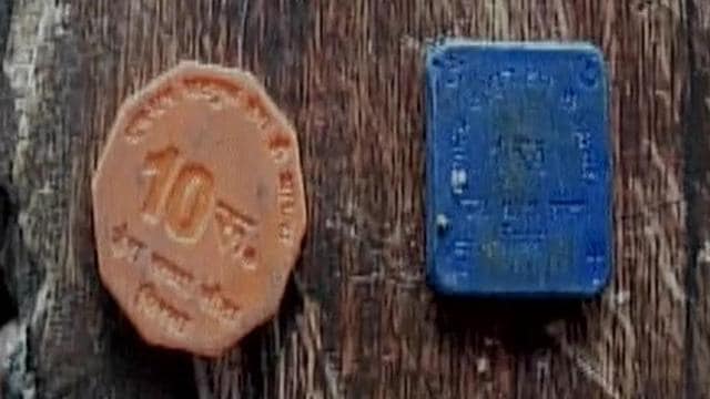 A photo of the plastic coins used as currency that were recovered from Dera headquarters. (ANI image) A photo of the plastic coins used as currency that were recovered from Dera headquarters. (ANI image)
