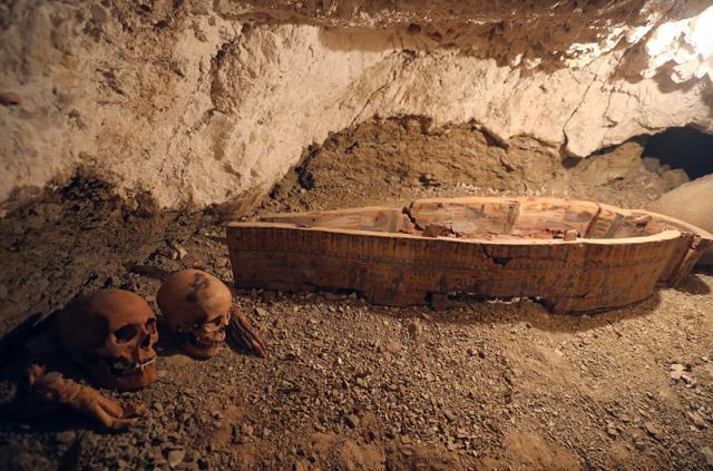 Skulls and hands are seen next to coffin in the recently discovered tomb of Amenemhat, a goldsmith from the New Kingdom, at the Draa Abu-el Naga necropolis near the Nile city of Luxor, south of Cairo on September 9. (REUTERS) Skulls and hands are seen next to coffin in the recently discovered tomb of Amenemhat, a goldsmith from the New Kingdom, at the Draa Abu-el Naga necropolis near the Nile city of Luxor, south of Cairo on September 9. (REUTERS)