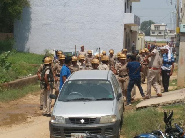 Police baton-charge protesters outside the school on Sunday. (HT photo)