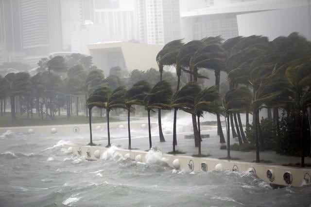 Waves crash over a seawall from Biscayne Bay as Hurricane Irma passes by, in Miami. (AP) Waves crash over a seawall from Biscayne Bay as Hurricane Irma passes by, in Miami. (AP)