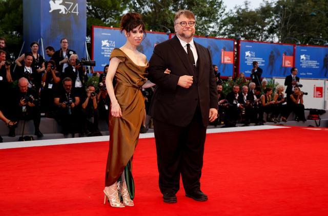 Director Guillermo del Toro (R) poses with actor Sally Hawkins during a red carpet event for the movie The Shape of Water at Venice. (REUTERS)