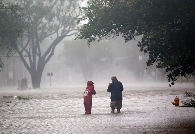 A television news crew wades into a flooded street in the Brickel section of Miami as Hurricane Irma passes by. (AP) A television news crew wades into a flooded street in the Brickel section of Miami as Hurricane Irma passes by. (AP)