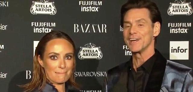 A mortified Catt Sadler with Jim Carrey. A mortified Catt Sadler with Jim Carrey.