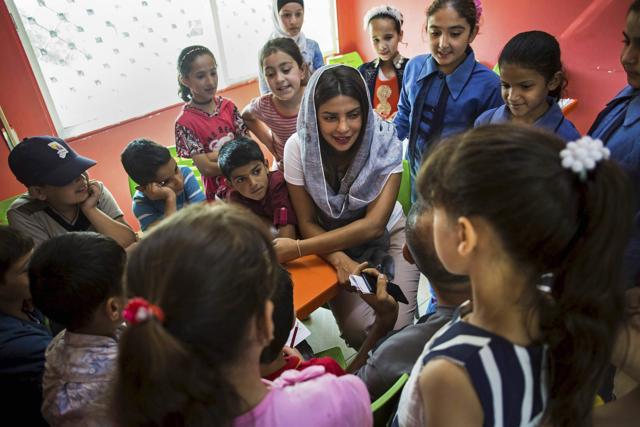 Amman : Priyanka Chopra, a UNICEF Goodwill Ambassador, greets a Syrian woman and her baby at UNICEF's Makani Center in Amman, Jordan, Sunday, Sep. 10, 2017. (AP)