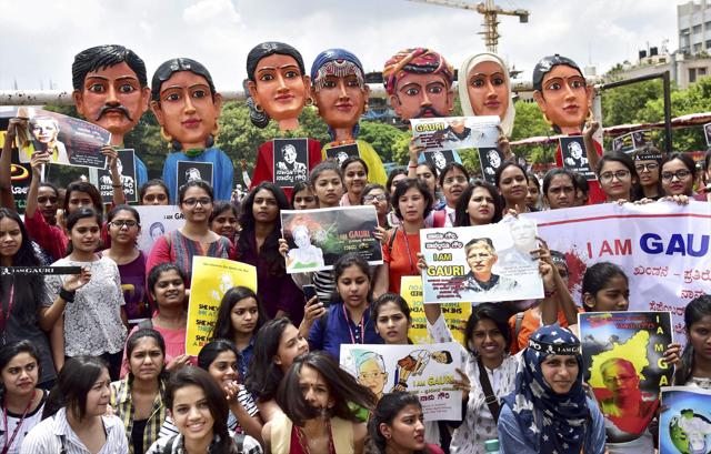 Protesters hold placards to condemn the murder of journalist Gauri Lankesh at the Central College ground. (PTI photo) Protesters hold placards to condemn the murder of journalist Gauri Lankesh at the Central College ground. (PTI photo)