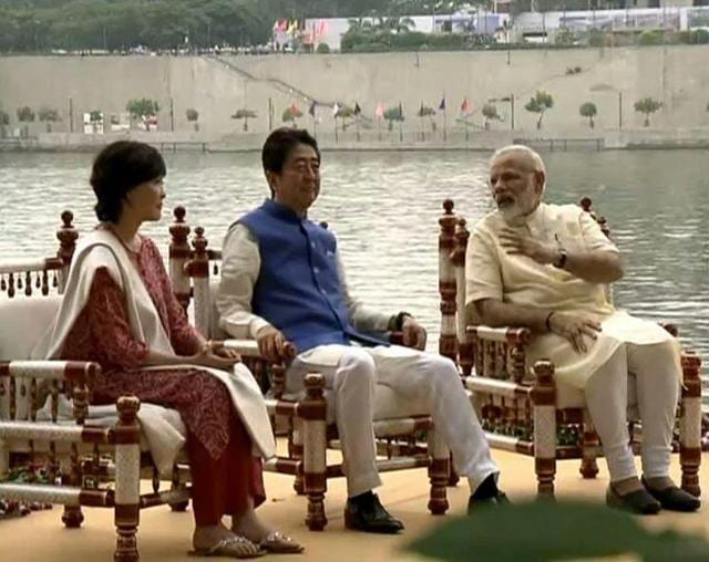 Shinzo Abe, his wife Akie Abe and PM Narendra Modi sit by the Sabarmati Riverfront in Ahmedabad. (HT Photo) Shinzo Abe, his wife Akie Abe and PM Narendra Modi sit by the Sabarmati Riverfront in Ahmedabad. (HT Photo)