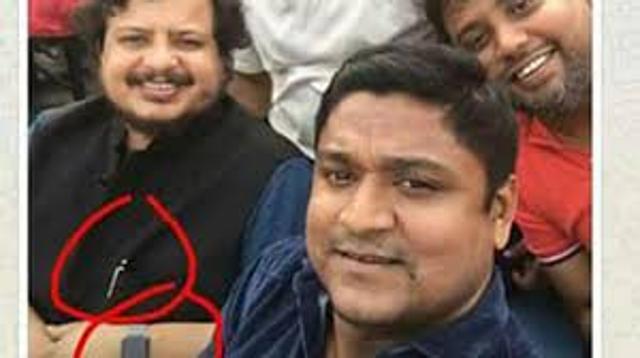 A photograph posted on social media shows the CPI(M) Rajya Sabha MP with his Apple watch and Mont Blanc pen circled in red. (Facebook) A photograph posted on social media shows the CPI(M) Rajya Sabha MP with his Apple watch and Mont Blanc pen circled in red. (Facebook)