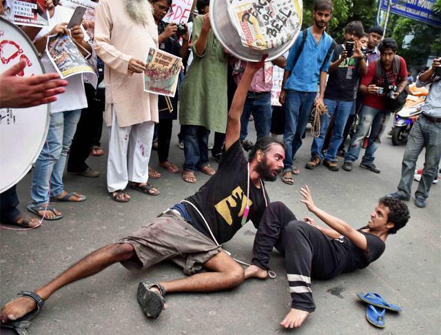 Students and activists during a demonstration in front of Myanmar Consulate against the genocide of Rohingya people in Kolkata. (PTI Photo) Students and activists during a demonstration in front of Myanmar Consulate against the genocide of Rohingya people in Kolkata. (PTI Photo)