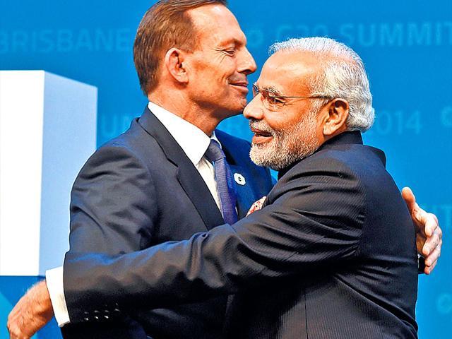 Narendra Modi and Australian PM Tony Abbott share a hug at the G20 summit. (AFP photo) Narendra Modi and Australian PM Tony Abbott share a hug at the G20 summit. (AFP photo)