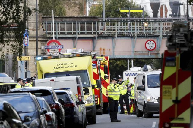 Ambulances and police stand nearby after an incident on a tube train at Parsons Green subway station in London. (AP) Ambulances and police stand nearby after an incident on a tube train at Parsons Green subway station in London. (AP)