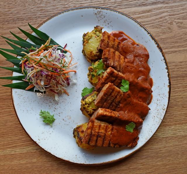 The criminally overpriced pork belly with sorpotel curry sauce consisted of stringy slices of overcooked meat, drowned in a sickly sweet syrup! (Satyabrata Tripathy / HT Photo)