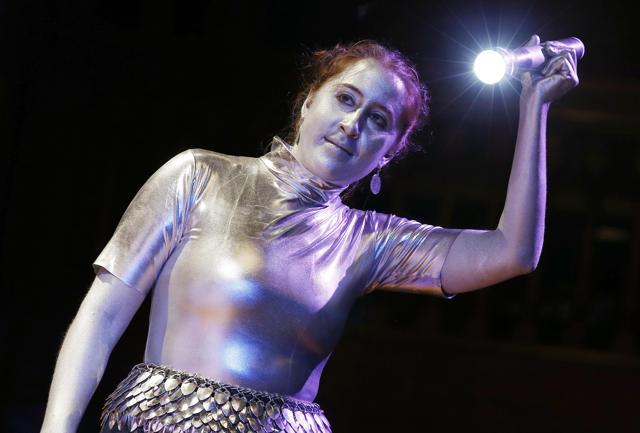 Human Spotlight Madeline Pelz illuminates the scene during Ig Nobel award ceremonies at Harvard University in Cambridge. (AP Photo)