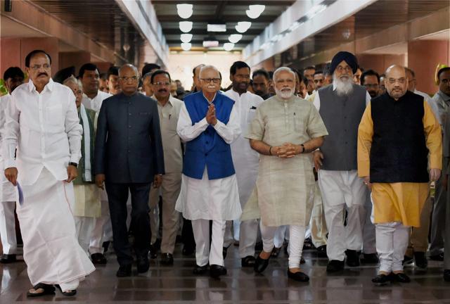 The NDA's presidential nominee Ram Nath Kovind with Prime Minister Narendra Modi, BJP chief Amit Shah, senior leader LK Advani, former Punjab chief minister Parkash Singh Badal and other NDA leaders, as Kovind proceeds to file his nomination papers at Parliament in New Delhi on June 23, 2017. (Subhav Shukla/PTI) The NDA's presidential nominee Ram Nath Kovind with Prime Minister Narendra Modi, BJP chief Amit Shah, senior leader LK Advani, former Punjab chief minister Parkash Singh Badal and other NDA leaders, as Kovind proceeds to file his nomination papers at Parliament in New Delhi on June 23, 2017. (Subhav Shukla/PTI)