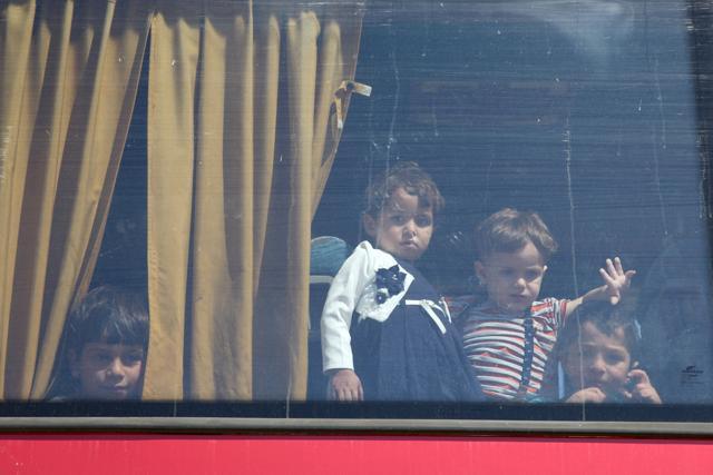 Syrian refugee children are seen on a bus at the Kokkinotrimithia refugee camp outside Nicosia, Cyprus September 10, 2017. Passengers reported paying $2,000 each for the trip taking them out of the Syrian conflict zone. (Yiannis Kourtoglou / REUTERS) Syrian refugee children are seen on a bus at the Kokkinotrimithia refugee camp outside Nicosia, Cyprus September 10, 2017. Passengers reported paying $2,000 each for the trip taking them out of the Syrian conflict zone. (Yiannis Kourtoglou / REUTERS)