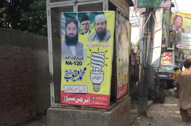 Poll posters with the image of JuD chief Hafiz Saeed, despite the Pakistan Election Commission warning against the same. (via Twitter)