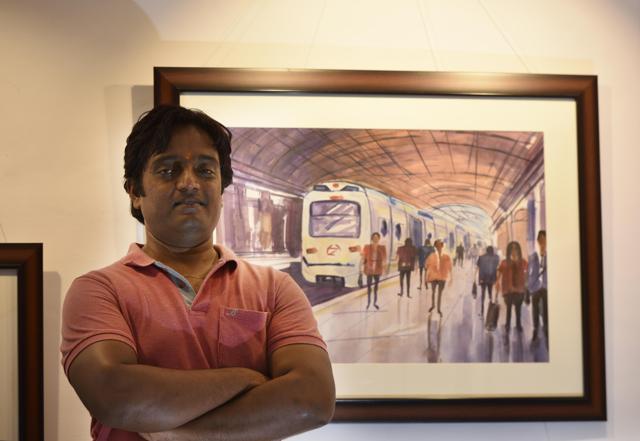 Amit Kumar with his water colour art work. (Vipin KUmar /HT PHOTO)
