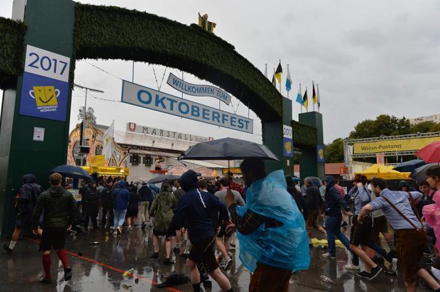 Visitors on the opening day of the Oktoberfest. The festival kicks off with the mayor tapping the first keg at noon. (Guenter Schiffmann/AFP) Visitors on the opening day of the Oktoberfest. The festival kicks off with the mayor tapping the first keg at noon. (Guenter Schiffmann/AFP)