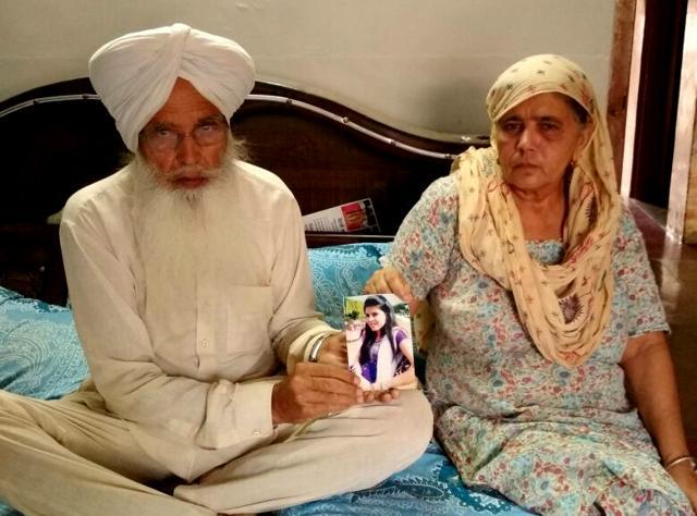 Father Seerat Singh and mother Malkiat Singh showing picture of their missing daughter Sukhpreet Kaur at their home in Moga on Monday. (HT Photo) Father Seerat Singh and mother Malkiat Singh showing picture of their missing daughter Sukhpreet Kaur at their home in Moga on Monday. (HT Photo)