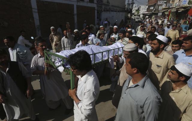 Villagers carry the body of university student Mashal Khan for burial in Swabi, Pakistan, on April 14, 2017. Police said a group of students at Abdul Wali Khan University in the northwestern city of Mardan attacked and killed Khan after accusing him of sharing blasphemous content on Facebook. (AP)