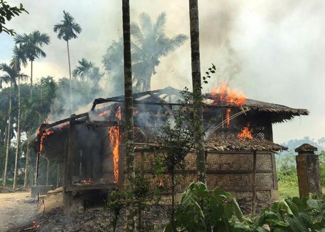 In this Sept. 7, 2017 file photo, flames engulf a house in Gawdu Zara village, northern Rakhine state, Myanmar. (AP) In this Sept. 7, 2017 file photo, flames engulf a house in Gawdu Zara village, northern Rakhine state, Myanmar. (AP)