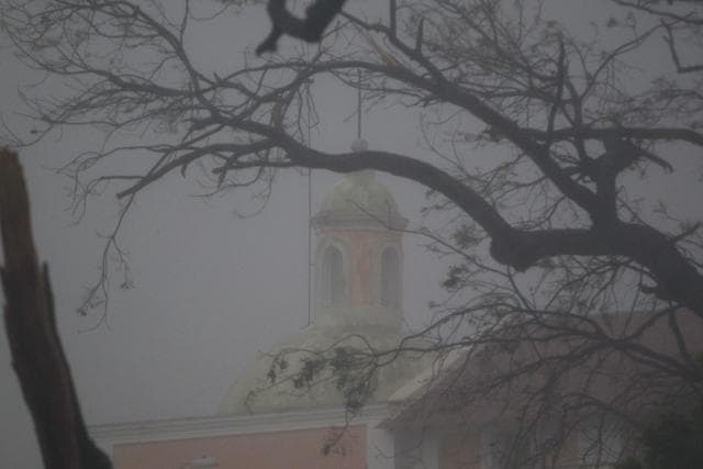 The top of a church is seen through branches as Hurricane Maria hits Puerto Rico in Fajardo, on September 19. (AFP) The top of a church is seen through branches as Hurricane Maria hits Puerto Rico in Fajardo, on September 19. (AFP)