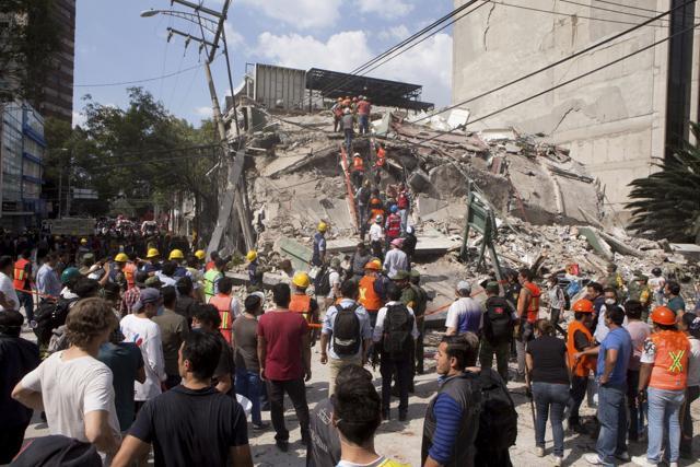 Volunteers and first responders look for survivors in a collapsed building after an earthquake struck Mexico City. (AP) Volunteers and first responders look for survivors in a collapsed building after an earthquake struck Mexico City. (AP)