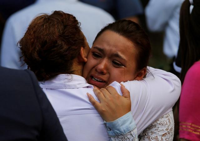 A woman reacts outside a collapsed building after an earthquake in Mexico City, Mexico. (Reuters Photo)