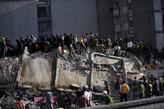 Police called for calm and cordoned off streets with grotesquely twisted buildings, their reinforcing steel poking out from concrete. The quake -- which occurred in the early afternoon, hours after city authorities had conducted an earthquake drill -- caused damage in the bustling centre of the city, and to areas south and west of the capital. (AFP) Police called for calm and cordoned off streets with grotesquely twisted buildings, their reinforcing steel poking out from concrete. The quake -- which occurred in the early afternoon, hours after city authorities had conducted an earthquake drill -- caused damage in the bustling centre of the city, and to areas south and west of the capital. (AFP)