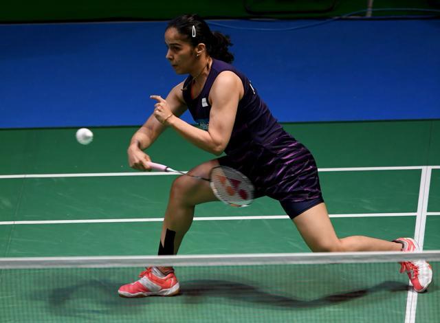 Saina Nehwal of India hits a return against Carolina Marin of Spain during their women's singles second round match at the Japan Open badminton. (AFP) Saina Nehwal of India hits a return against Carolina Marin of Spain during their women's singles second round match at the Japan Open badminton. (AFP)