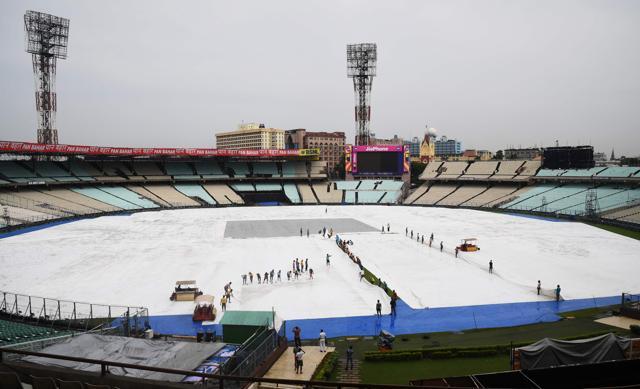 Groundstaff at Eden Gardens in Kolkata. The 2nd ODI between India vs Australia on Thursday could be hit by rain. (AFP) Groundstaff at Eden Gardens in Kolkata. The 2nd ODI between India vs Australia on Thursday could be hit by rain. (AFP)