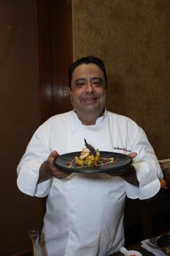 Chef Manish Mehrotra of Indian Accent with his dish - Warm prawn and potato salad.