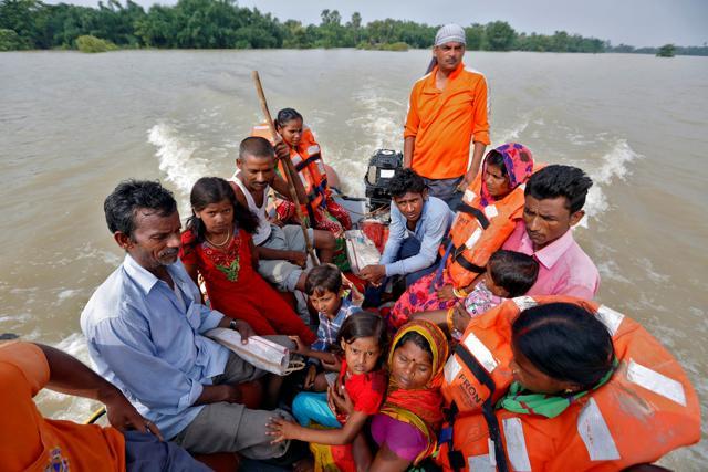 People are rescued from a flooded village in the eastern state of Bihar. (Reuters Photo) People are rescued from a flooded village in the eastern state of Bihar. (Reuters Photo)