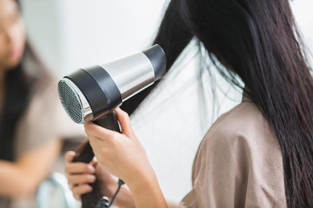 Let your hair dry naturally a bit before using the heat of a blow dryer to avoid damage to hair. (Shutterstock) Let your hair dry naturally a bit before using the heat of a blow dryer to avoid damage to hair. (Shutterstock)