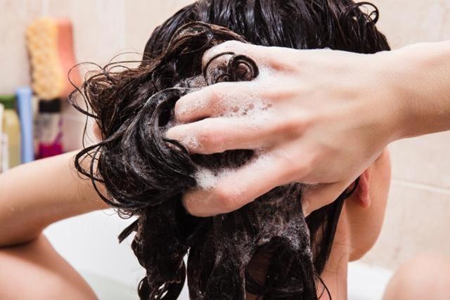 Washing hair too often can result in a loss of natural oils. Aim to wash hair only two to three times a week. (Shutterstock) Washing hair too often can result in a loss of natural oils. Aim to wash hair only two to three times a week. (Shutterstock)