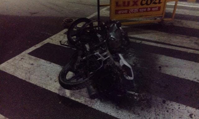 A burnt vehicle lies on the road after a clash between security forces and students of the BHU. (HT Photo) A burnt vehicle lies on the road after a clash between security forces and students of the BHU. (HT Photo)