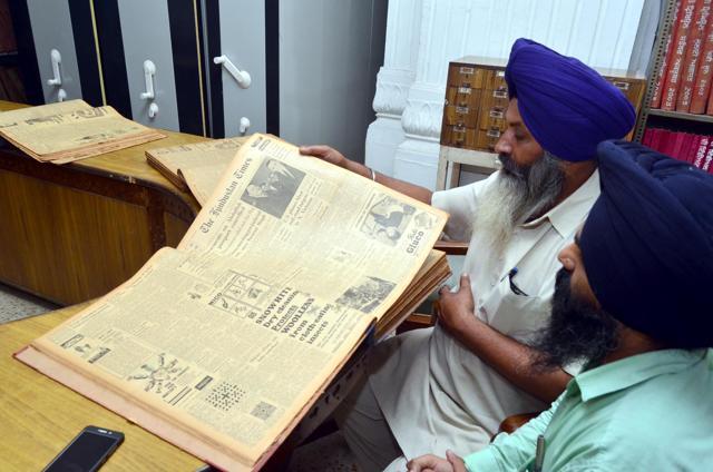 A researcher finding a piece of writing in a Hindustan Times edition from 1965. Besides other newspapers’, editions of Hindustan Times have been preserved at the Sikh Reference Library since 1955. (Sameer Sehgal/HT) A researcher finding a piece of writing in a Hindustan Times edition from 1965. Besides other newspapers’, editions of Hindustan Times have been preserved at the Sikh Reference Library since 1955. (Sameer Sehgal/HT)